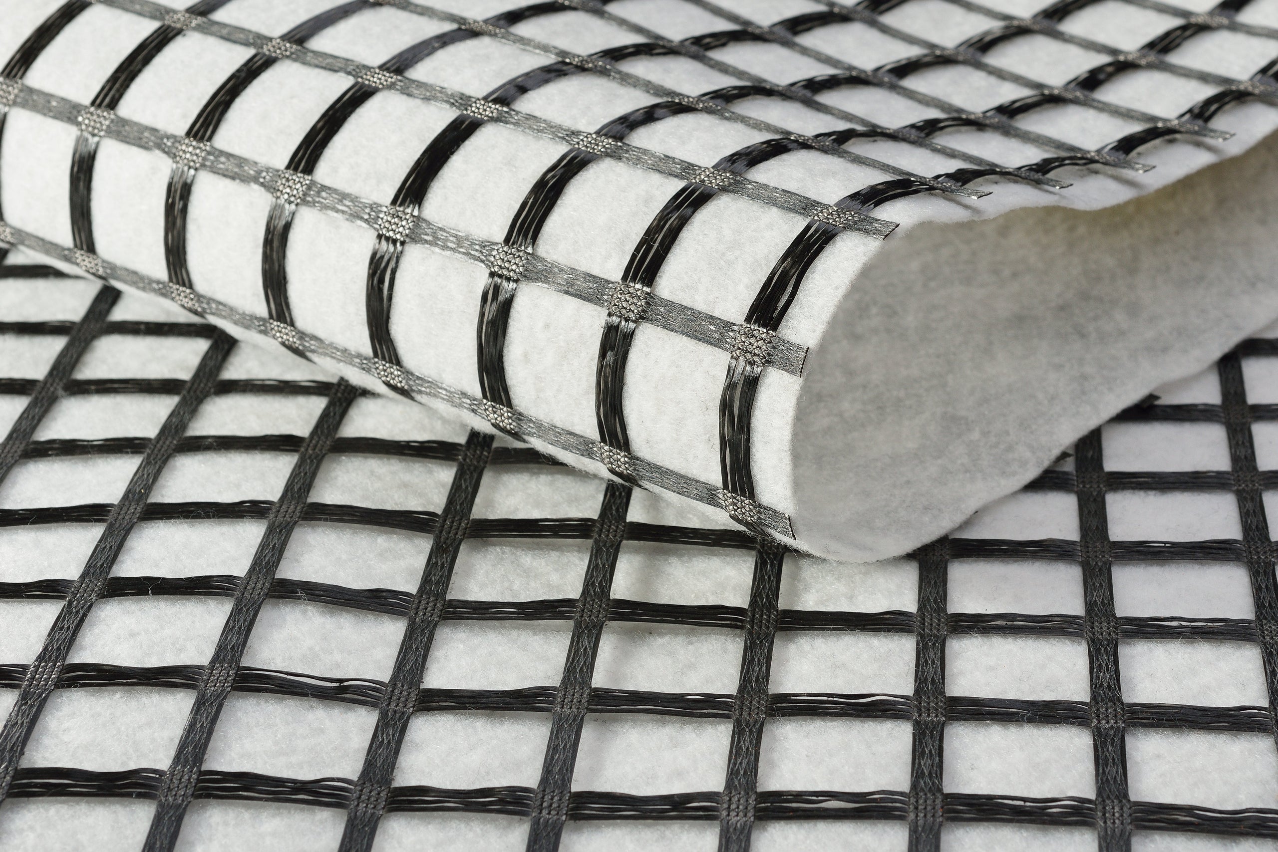 Geocomposites: combination of geogrid and geotextile (nonwoven)